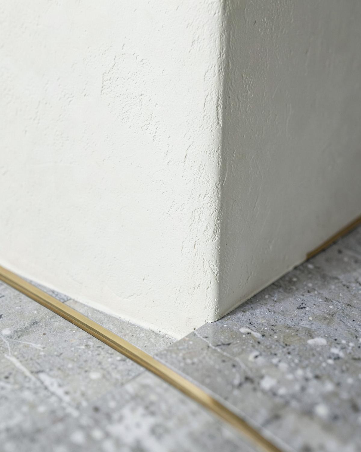 Three millimetres of brass at every threshold